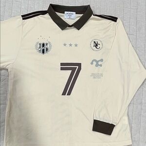 Cream Long Sleeve Jersey with dark brown collar. Size small brand Noycommon